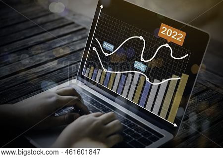 Businessman Using Laptop With Analyzing Forex Trading Graph Financial Data. Business Finance Technol