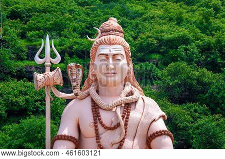 Hindu God Shiva Sculpture Sitting In Meditation. Yoga And Meditation Concept.