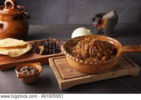 Tinga De Res. Typical Mexican Dish Prepared Mainly With Shredded Beef, Onion And Dried Chilies. It I