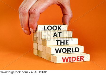 Look At The World Wider Symbol. Concept Words Look At The World Wider On Wooden Blocks On A Beautifu