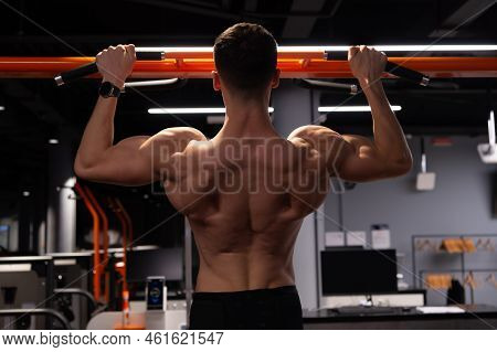 Sport Athlete Do Pullup In Fitness Gym. Pullup Practicing Athlete In Gym. Sport And Fitness.