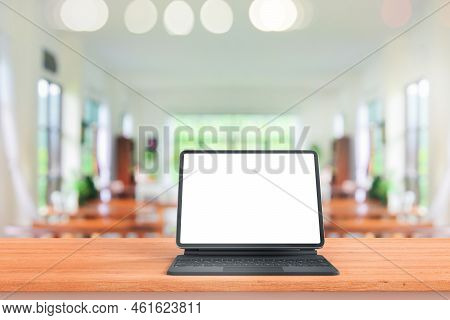 Digital Tablet Mock Up Placed On Wooden Table In Blurred Coffee Shop Or Restaurant For Menu Or Order