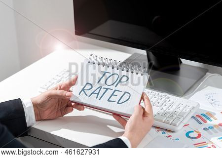 Hand Writing Sign Top Rated. Internet Concept The High Amount Of A Charge Or Payment Based On Calcul
