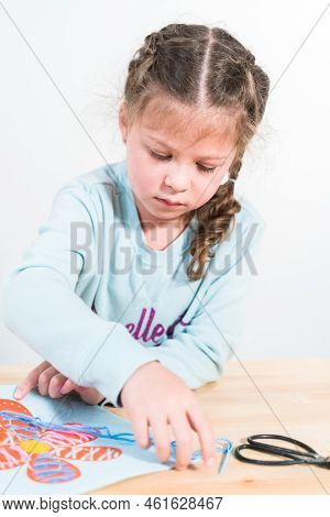 Little Girl Learning How To Sew With Sewing Craft Kit For Kids.