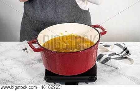 Cooking Chicken Noodle Soup With Kluski Noodles In An Enameled Dutch Oven.