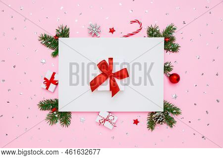Christmas, New Year Holiday Layout. White Gift Box With Red Bow In Frame Of Natural Fir Tree Branche