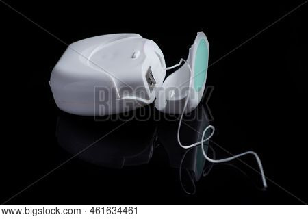 Container With Dental Floss. Floss On Black Background. White Dental Floss Case Isolated. Open Denta