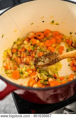 Cooking Chicken Noodle Soup With Kluski Noodles In An Enameled Dutch Oven.