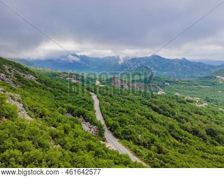 Beautiful View Of The Mountains Of Montenegro And Skadar Lake Portrait Of A Disgruntled Girl Sitting