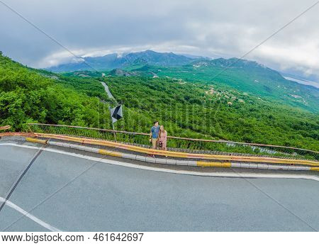 Couple Man And Woman On The Background Of Beautiful View Of The Mountains Of Montenegro And Skadar L