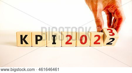 Kpi, Key Performance Indicator Symbol. Businessman Turns Wooden Cubes With Words Kpi 2022 And Kpi 20
