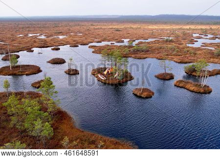 Trip On Swamp Yelnya In Autumn. Adventure On Kayak In Wild Mire. Camping In A Tent In Wild Nature On