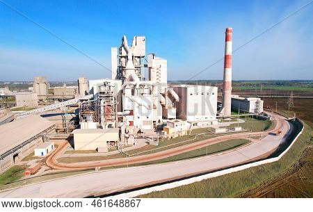 Industrial Plant, Aerial View. Cement Plant With Pipes On Cement Production. Factory With Smoke Pipe