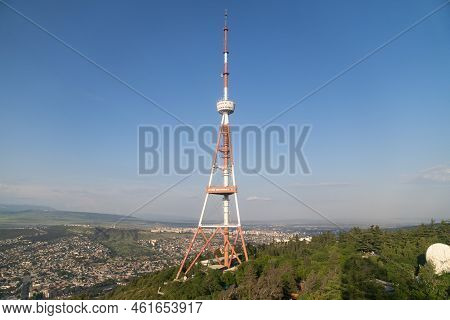 Grey And Red Tv Tower With Antenna Wires Used For Supporting Television Transmitting And Broadcastin