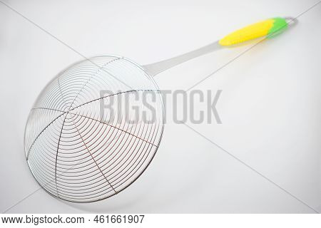 Stainless Steel Sieve For Scooping Food From A Pan That Has Hot Oil