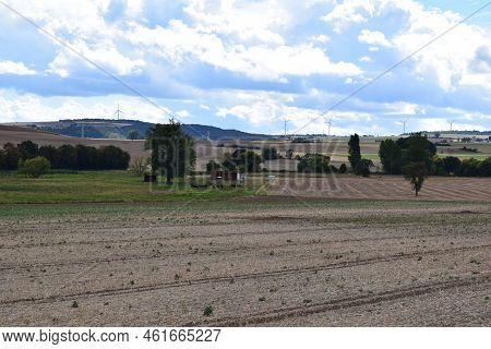 Harvested Fields Under Gloomy Storm Clouds In Late Summer