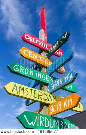 Colorful Signpost Pointing To Various Cities In Appingedam, Netherlands