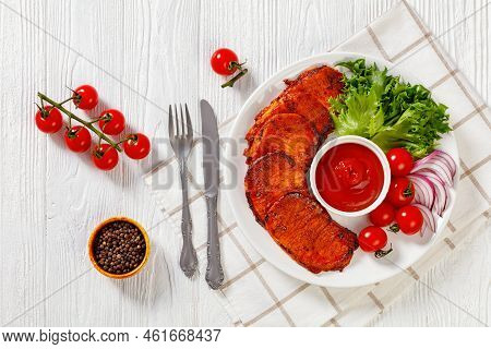 Grilled Slices Of Pork Loin Marinated In Paprika Based Sauce With  Tomatoes And Lettuce, Red Onion O