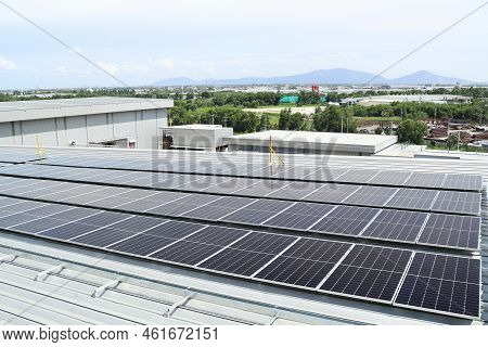 Solar Pv On Warehouse Roof Mountain Background