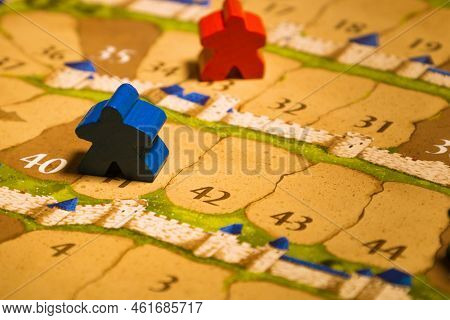 Board Games Meeples Standing On Score Track Close-up