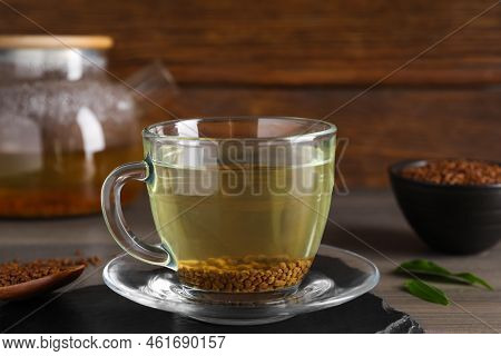 Freshly Made Buckwheat Tea In Glass Cup On Wooden Table, Closeup