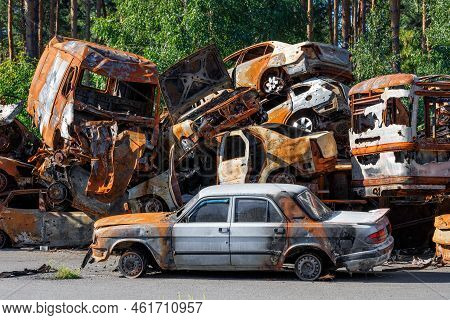 Mountains Of Skeletons Of Burned Cars Piled Up After The Expulsion Of Russian Invaders Near The City