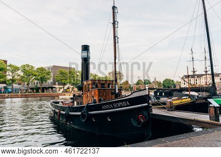 Amsterdam, Netherlands - May 6, 2022: Old Wooden Vessels Moored In The Society Museum Harbor Amsterd