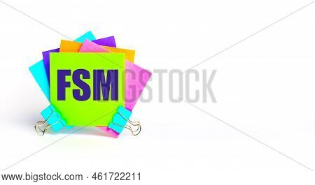 There Are Bright Multi-colored Stickers With The Text Fsm Field Service Management. Copy Space