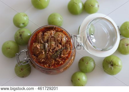 Amla Pickle Or Gooseberry Pickle Stored In A Glass Bottle. It Is A Spicy Condiment Made With Amla Al