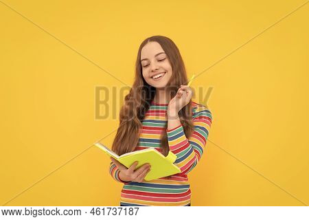 Reading Her School Essay. Happy Girl Hold Pen And Copybook. Essay Task. Essay-writing. Writing Story