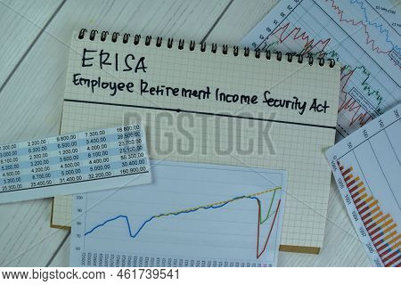 Concept Of Erisa - Employee Retirement Income Security Act Write On A Book Isolated On Wooden Table.