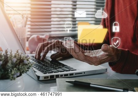 Document Management System Dms .businessman Hold Folder And Document Icon On Office Desk, Virtual On
