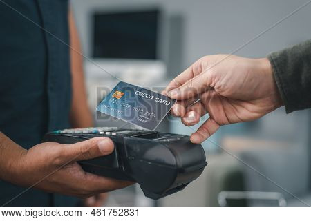 Customer Using Credit Card For Payment To Owner At Cafe Restaurant, Cashless Technology And Credit C