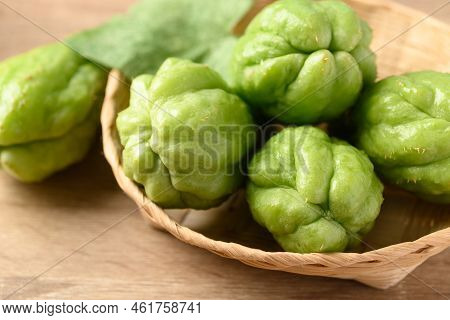 Chayote Squash Fruit In Basket On Wooden Table, Organic Vegetables