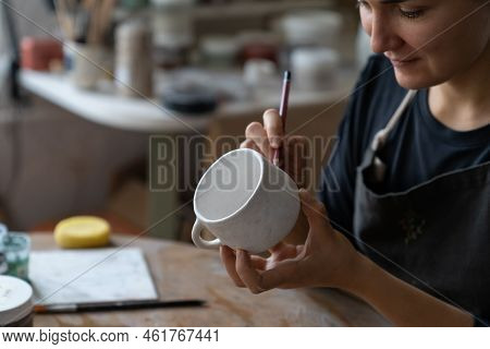 Happy Craftswoman Wants To Decorate Kitchen With Handmade Clay Dish With Patterns. Lady Master Enjoy