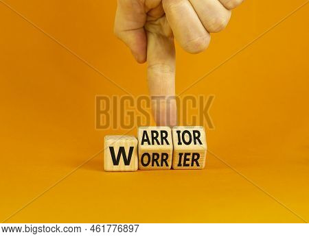 Be Warrior Not Worrier Symbol. Concept Words Warrior And Worrier On Wooden Cubes. Businessman Hand. 