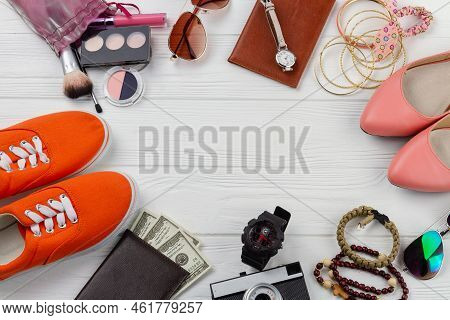 Mens And Womens Belongins And Copy Space. White Wooden Desk.