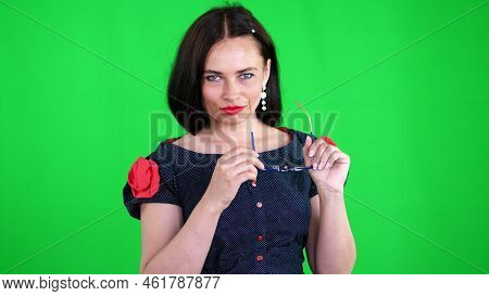 Green Background, Chromeakey. Portrait Of A Sexy Brunette Woman With Red Lips, In Stylish Glasses, S