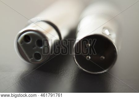 Xlr Audio Cable On Top Of A Black Table. Connections On Display. Xlr Cable Concept. Audio Concept.