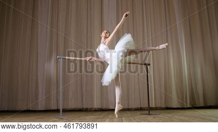 Ballet Rehearsal, In Old Theater Hall. Young Ballerina In White Ballet Skirt, Tutu, Is Engaged At Ba