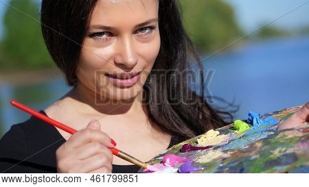 Summer, Outdoors, Portrait Of A Beautiful Forty Years Old Brunette Woman Artist, Close-up Of A Palet