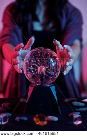 Closeup Image Of Fortune Teller Gazing Into Crystal Ball And Seeing Fortune