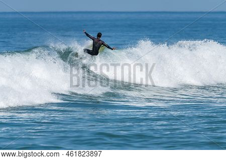 Surfer Riding Waves