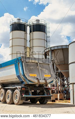 Large Dump Truck Near The Concrete Factory. Car Tonar For Transportation Of Heavy Bulk Cargo. Provis