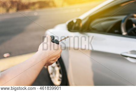 Close-up Of Driver Outside Car Holding Keys. Driver Hands Showing The Car Keys, Driver Hands Showing