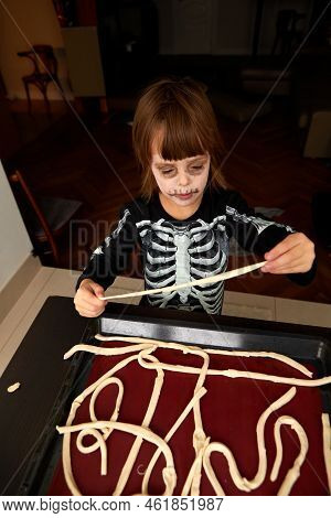 Boy Child In Skeleton Costume Preparing For Halloween Holiday
