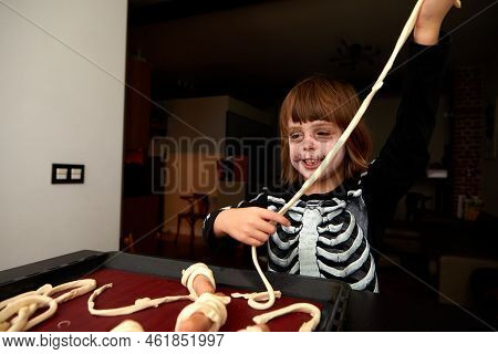 Boy Child In Skeleton Costume Preparing For Halloween Holiday