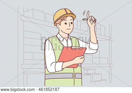 Man In Uniform And Helmet Working In Warehouse. Smiling Male Engineer Or Mechanic At Storehouse Or D