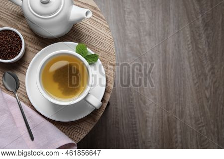 Buckwheat Tea On Wooden Table, Flat Lay. Space For Text