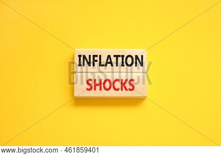 Inflation Shocks Symbol. Concept Words Inflation Shocks On Wooden Blocks. Beautiful Yellow Table Yel